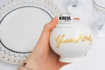 KREUL glass and porcelain pen in use on glassware and ceramic items with metallic finish
