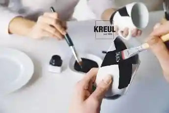 Close‑up of KREUL Glass & Porcelain Classic paint cup showing glossy, opaque colors.