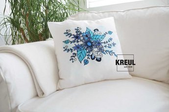 Decorative cushion with hand-painted blue silk design created using KREUL Javana silk paint