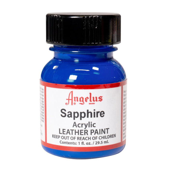 A small bottle of Angelus brand leather paint labeled "Sapphire" containing 1 fl. oz. (29.5 ml) of acrylic paint. The label advises to keep out of reach of children.  
